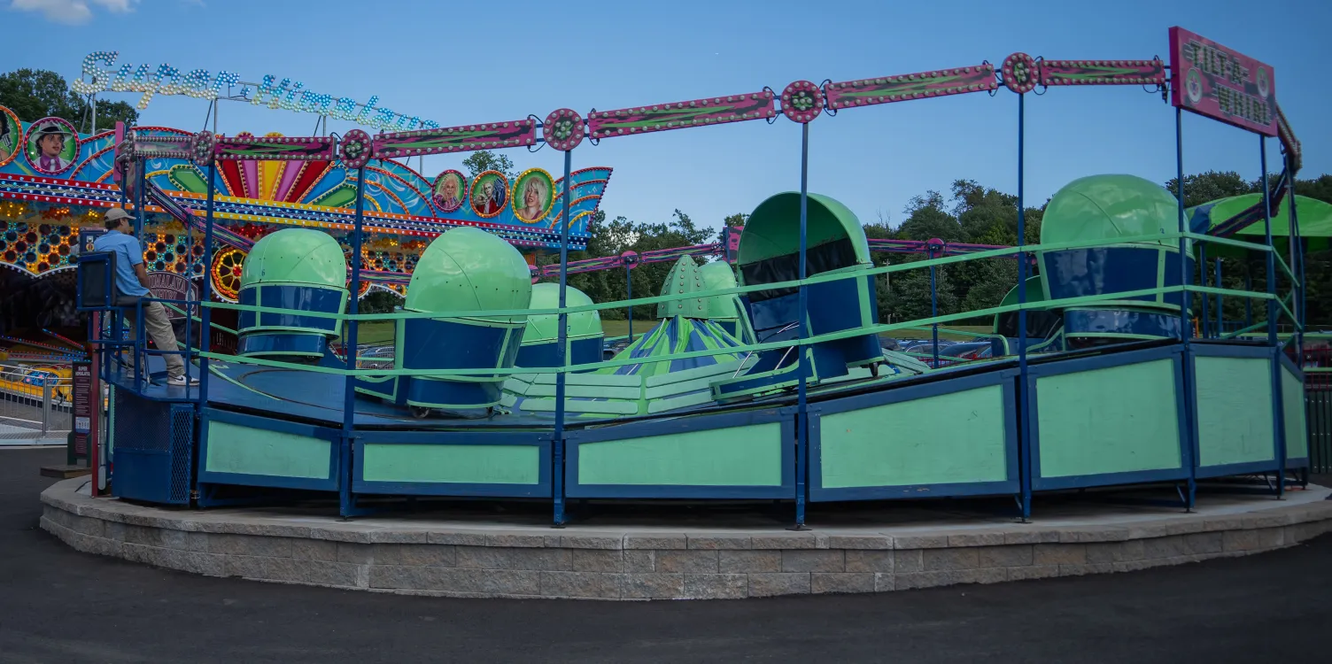 Shot of Tilt A Whirl ride, with no people inside