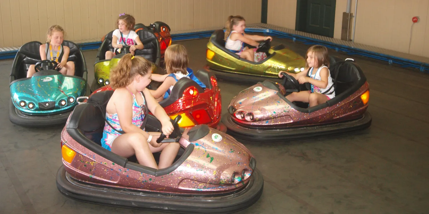 Children of various ages playing in Kiddie Bumper cars