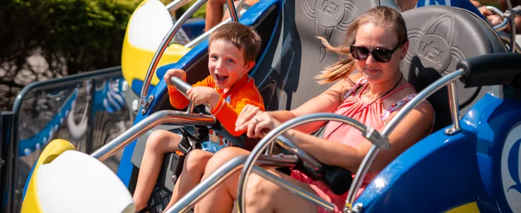 Child and adult on Crazy 8 Coaster
