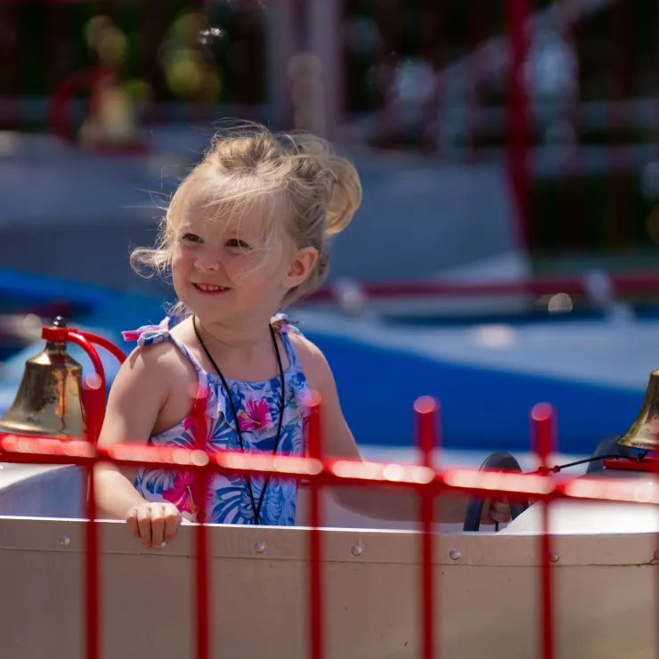 Girl sitting and smiling on Boat Ride
